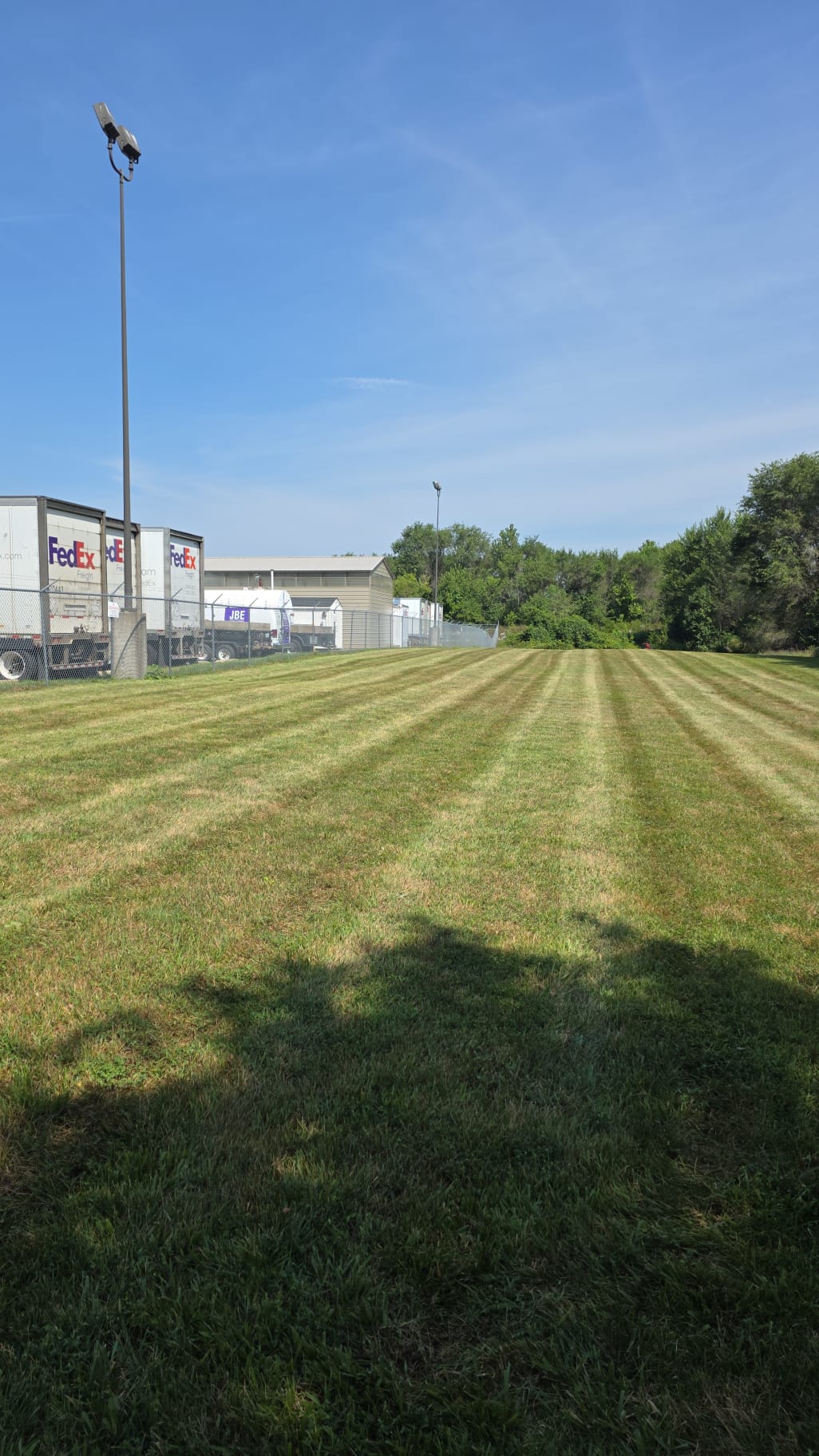 Professional commercial landscaping with perfectly striped lawn
